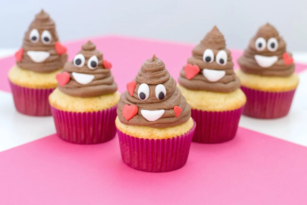 Poop-Emoji-Cupcakes-on-pink-and-white-table