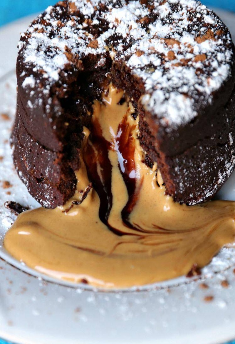 Peanut Butter Chocolate Molten Lava Cake with peanut butter oozing out.