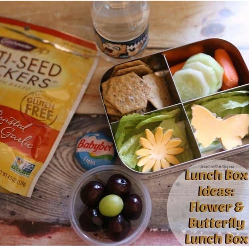 flower and butterfly lunchbox laid out on couter