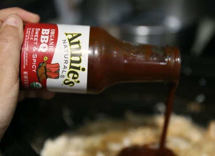 Zesty Slow Cooker Barbeque Chicken Sandwiches 11 pouring annies barbeque sauce