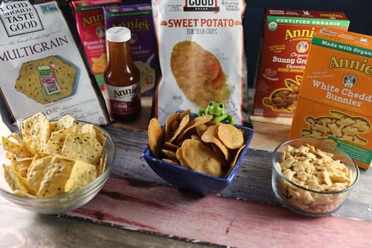 Zesty Slow Cooker Barbeque Chicken Sandwiches 15 annies bunnies, chips and crackers on countertop in bowls with bags in the background.