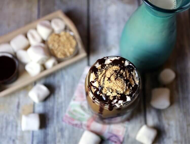 S'more's Iced Coffee in mason jar sitting on courter with marshmellows