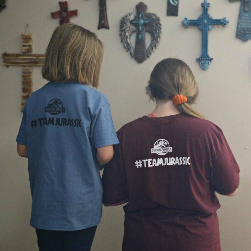 jenn brockman girls showing back of shirts that sy #teamjarassic