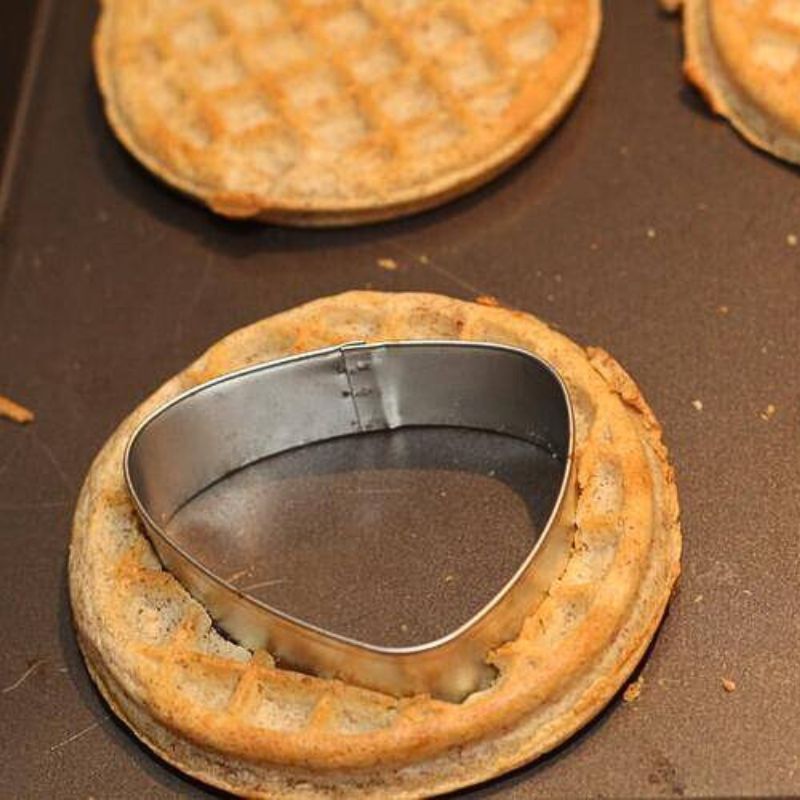 using cookie cutter to cut waffles