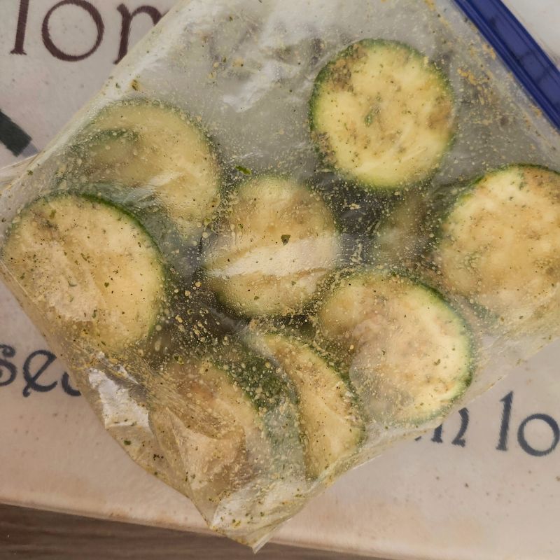 seasoning zucchini in baggie